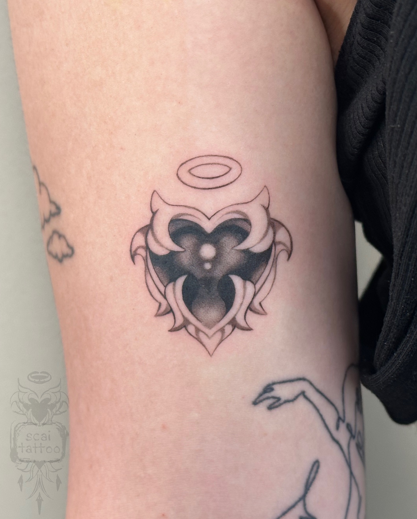 Heart with wings black and grey tattoo on the forearm by scaitattoo
