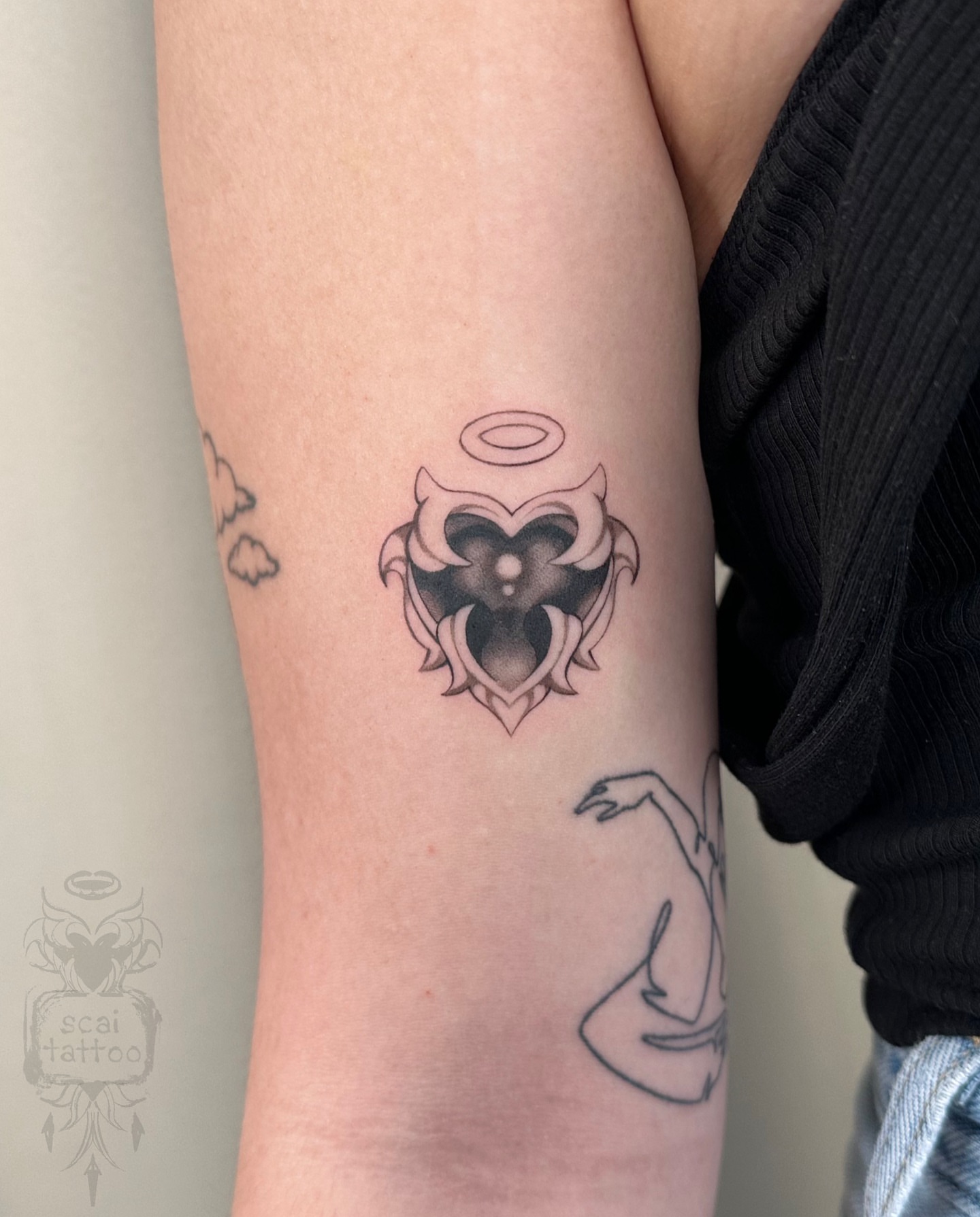Heart with owl black and grey tattoo on the forearm by scaitattoo