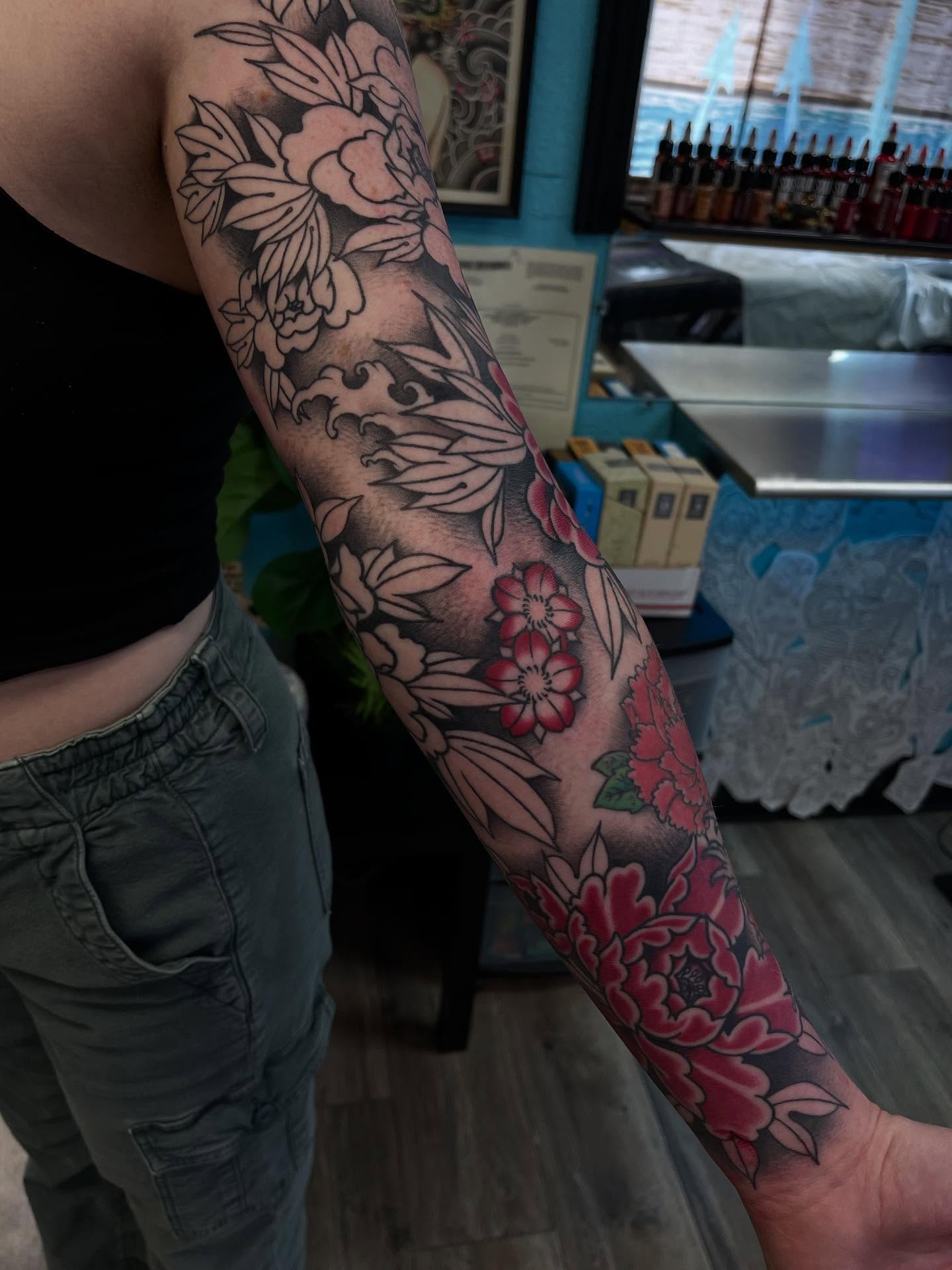 Floral bouquet American traditional tattoo on the forearm by Sacramento Tattoos (Ilona)