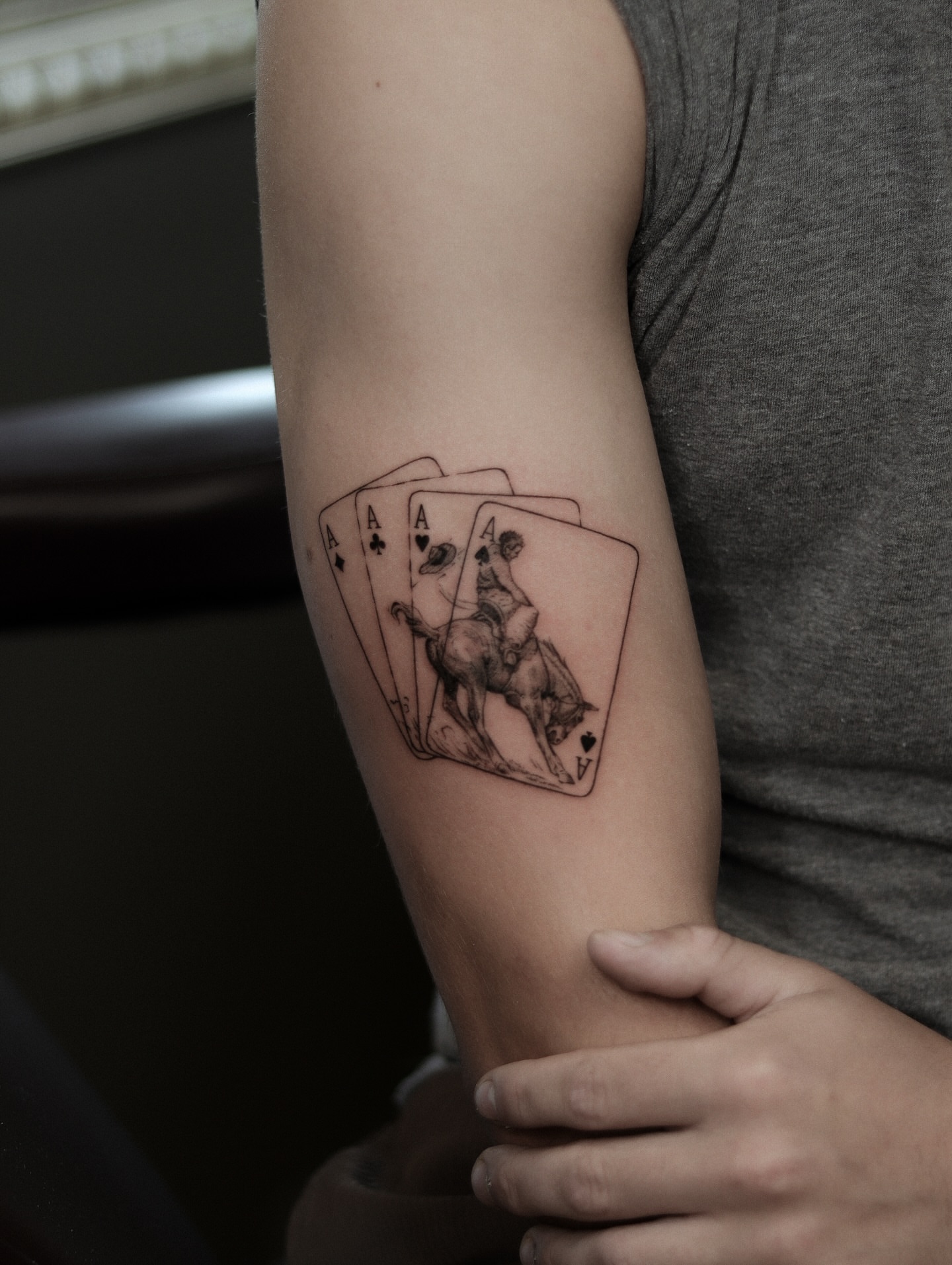 Ace of spades black and grey tattoo on the forearm by Arthur Kossoski