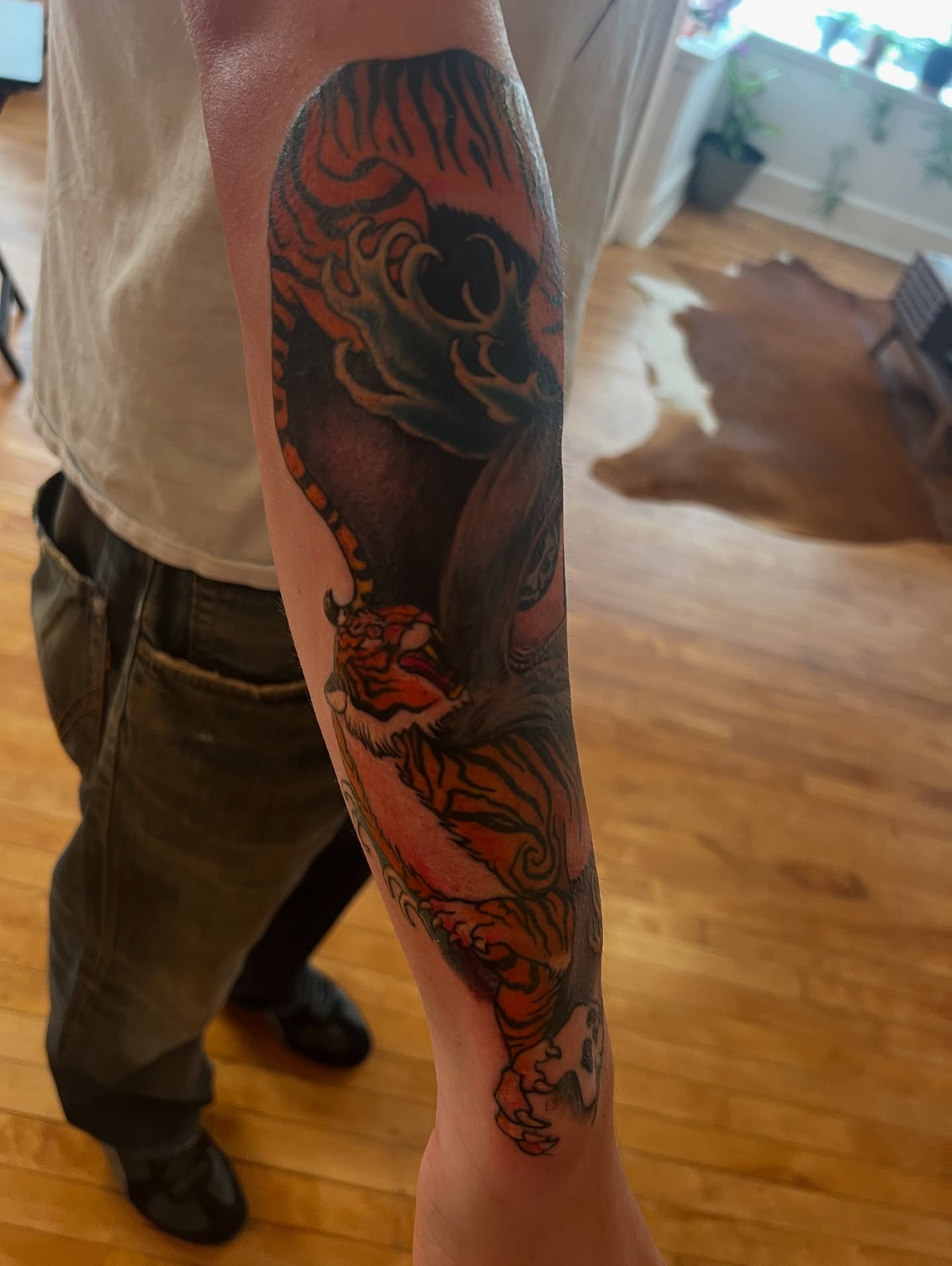 Tiger American traditional tattoo on the forearm by steven