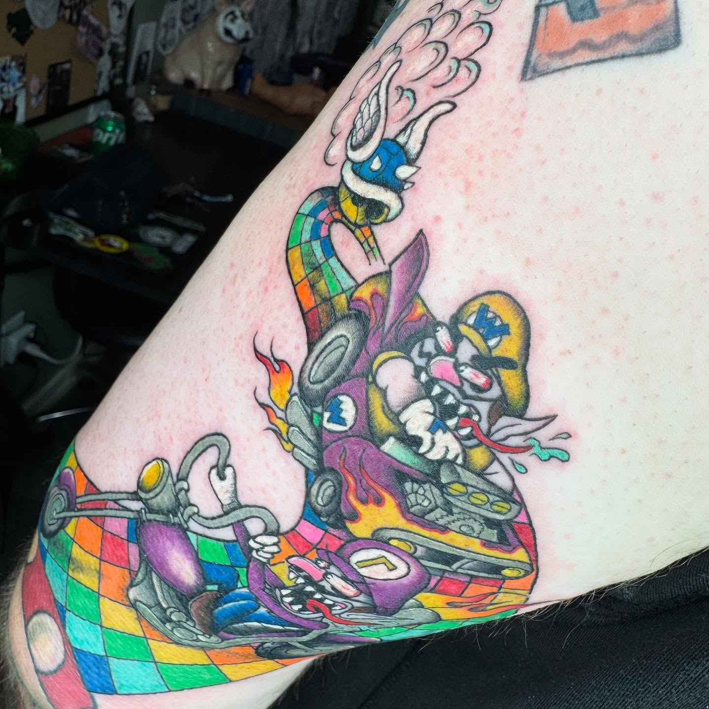 Race car driver new school tattoo on the upper arm by 𝕷𝖊𝖝𝖎 𝕽𝖚𝖓𝖞𝖔𝖓