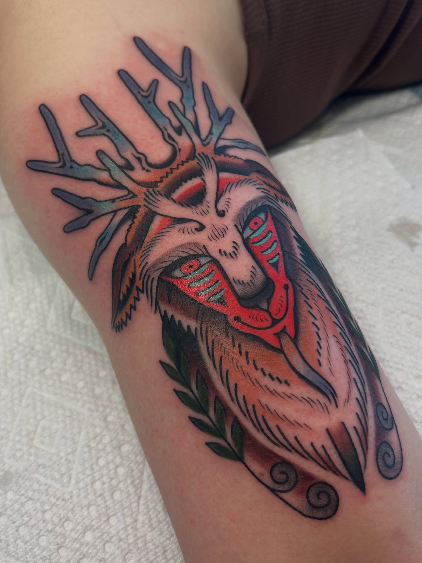 Deer head American traditional tattoo on the forearm by Lilly Binns