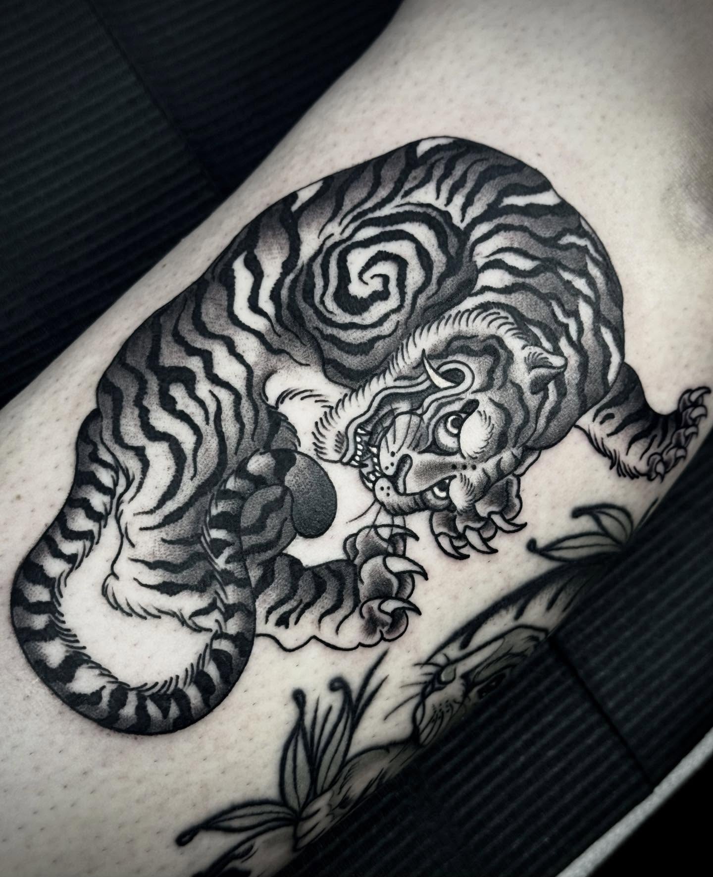 Tiger black and grey tattoo on the thigh by Ally noel
