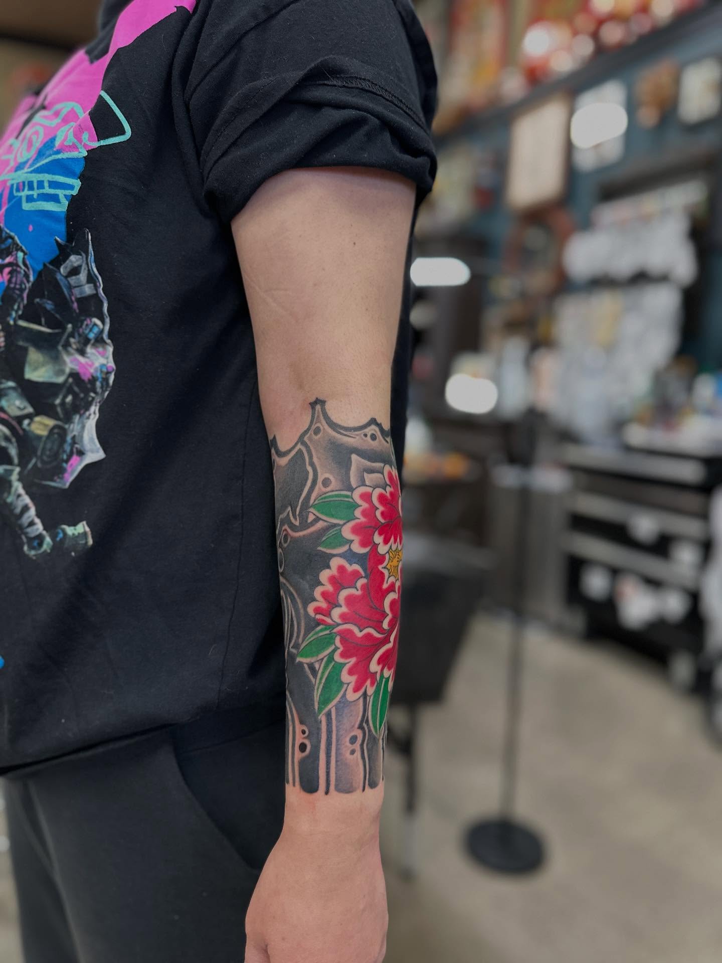 Peony and sword japanese irezumi tattoo on the forearm by Shawn Feng