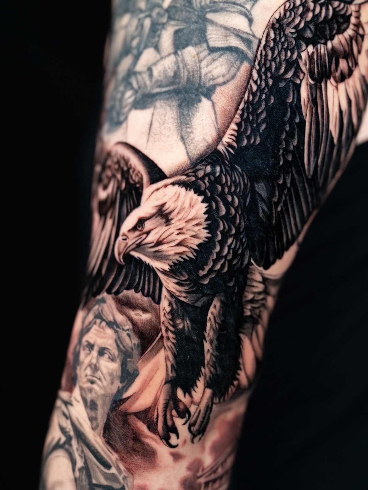 Eagle black and grey tattoo on the upper arm by Natalie Shaw