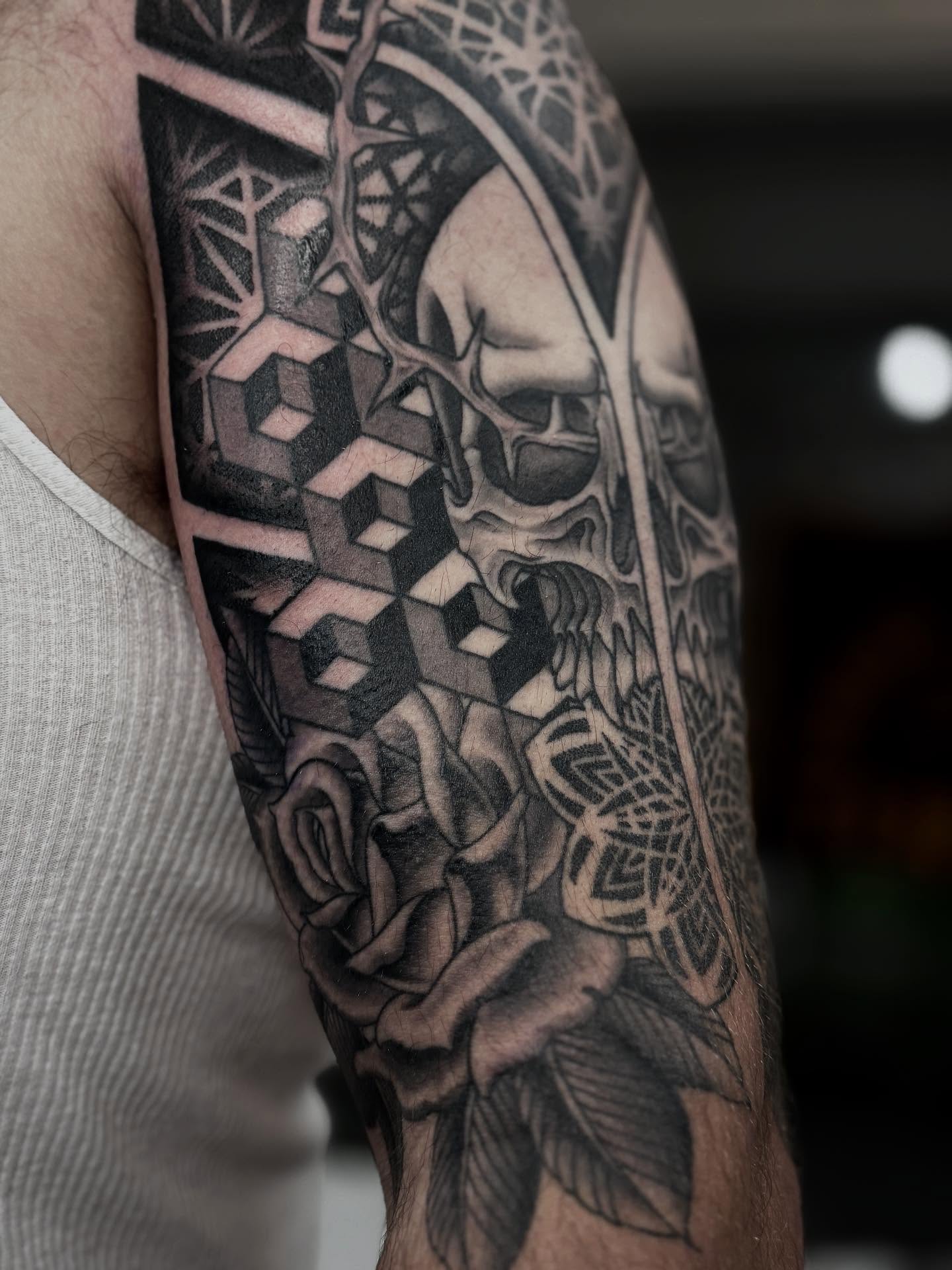 Geometric skull and roses geometric tattoo on the forearm by Cole Pittman Memphis Tattoo artist, Memphis, Tennessee