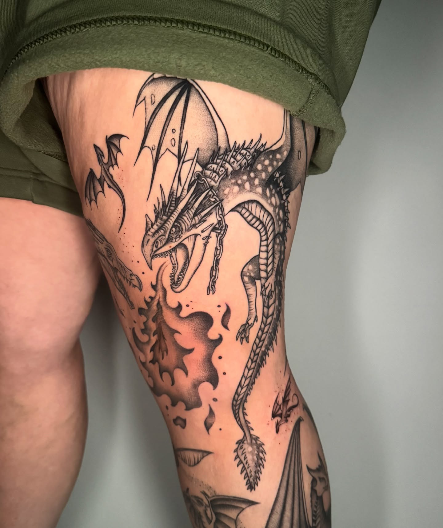 Dragon dotwork tattoo on the thigh by kelsey hackett