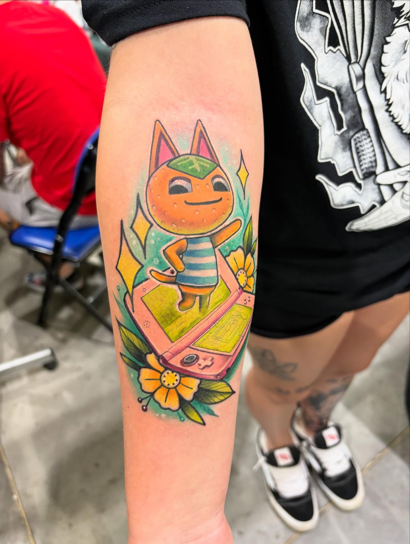 Animal crossing character new school tattoo on the forearm by Kodi Klo
