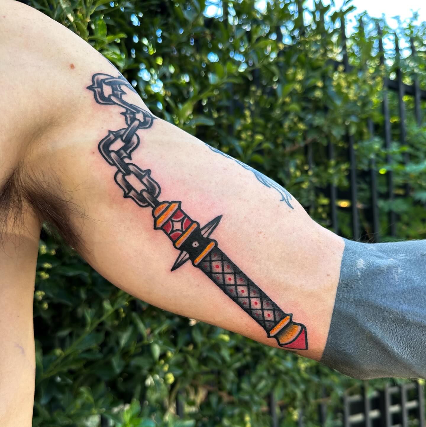 Chain and dagger American traditional tattoo on the forearm by Gabby Tolley🌛