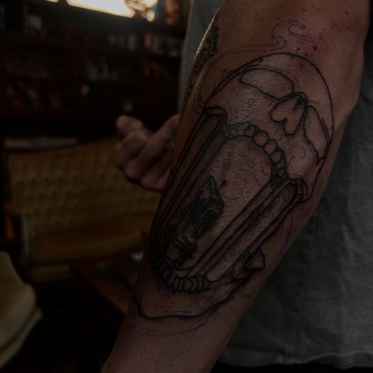 Skull and crossbones black and grey tattoo on the forearm by Amara Lyons, Matakana, New Zealand