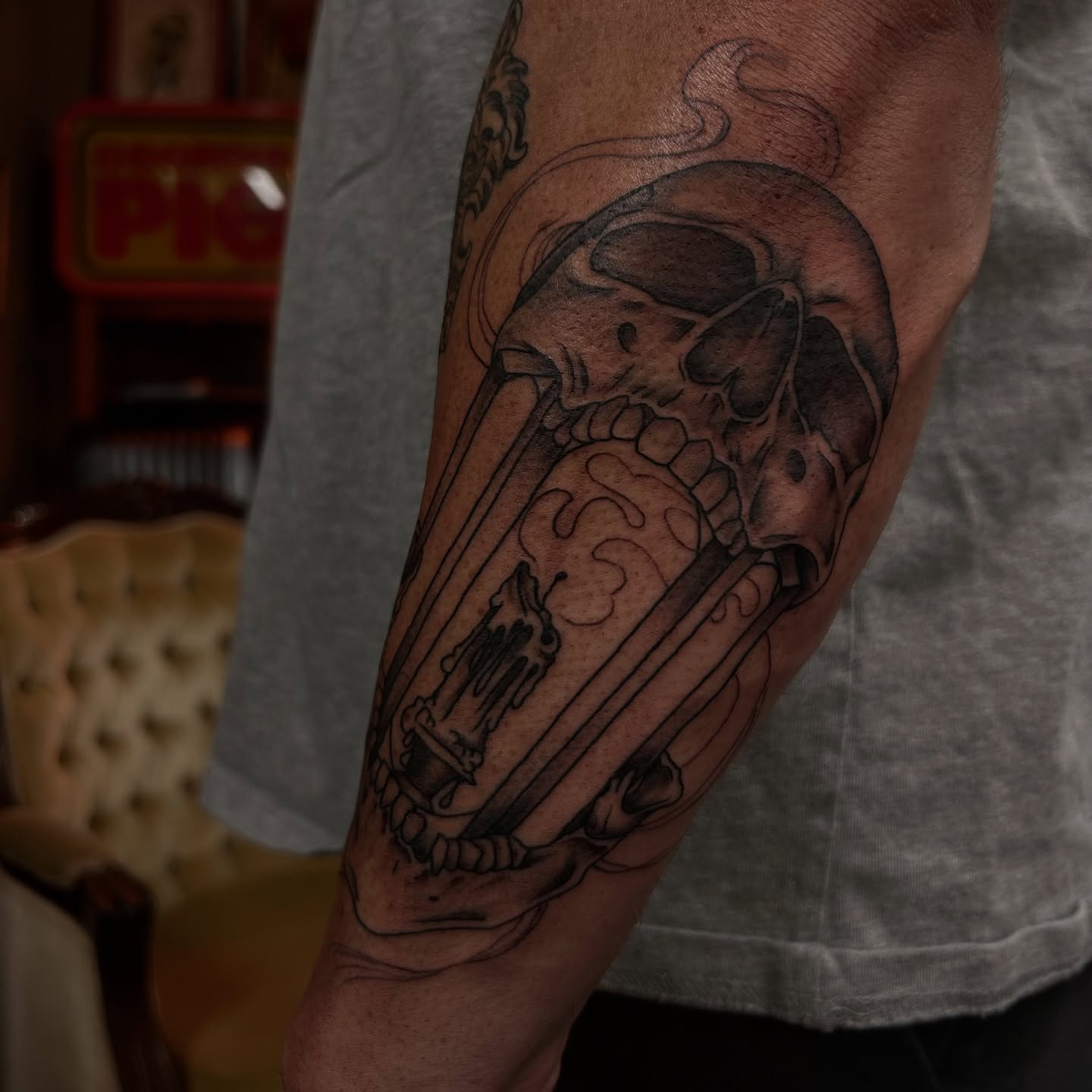 Skull and bones realism tattoo on the forearm by Amara Lyons, Matakana, New Zealand