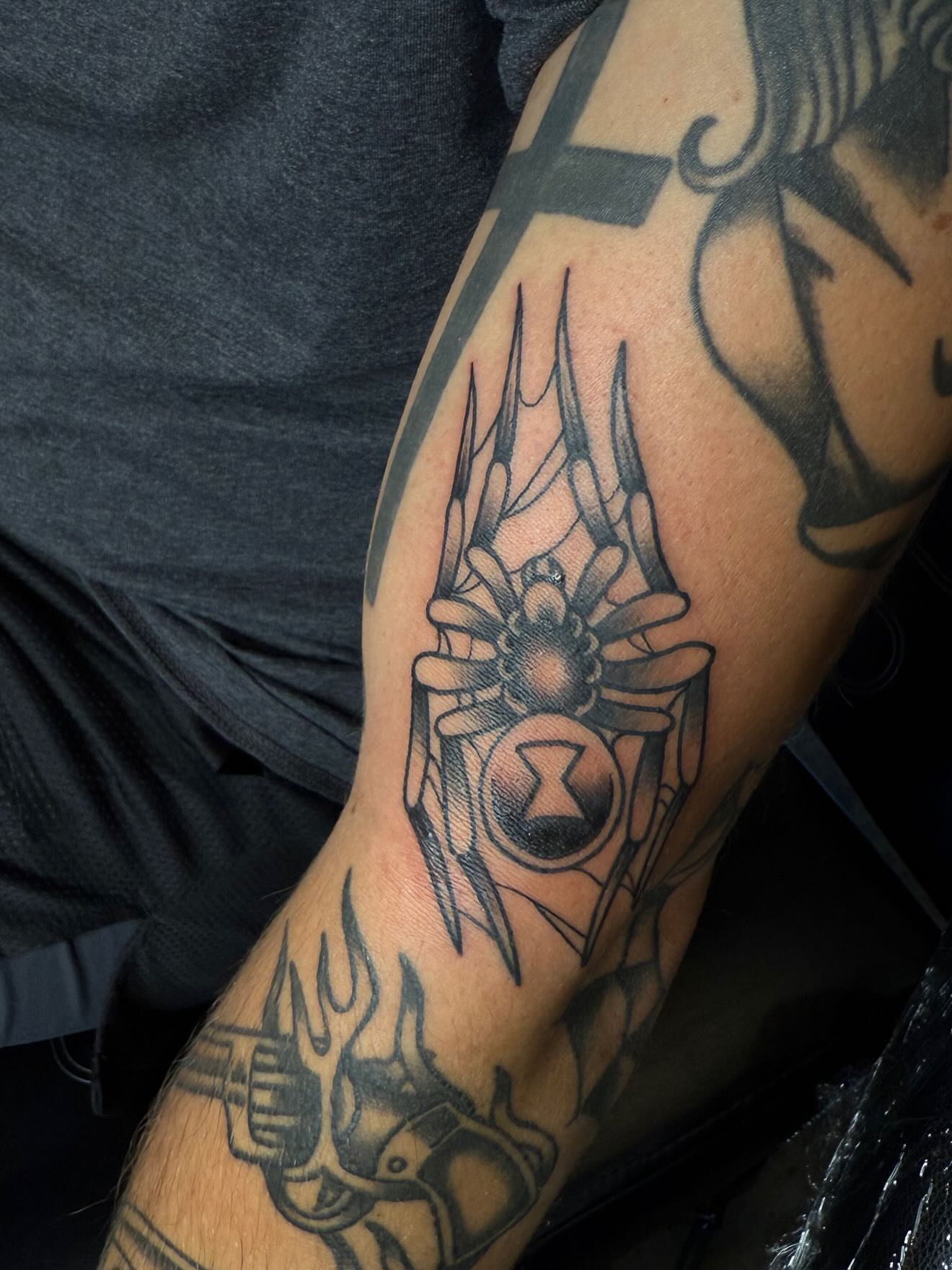 Spider black and grey tattoo on the forearm by frankie quadrini