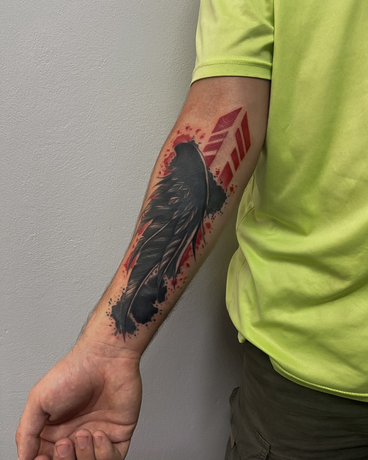 Wings and feathers neo-traditional tattoo on the forearm by Art by Aimee