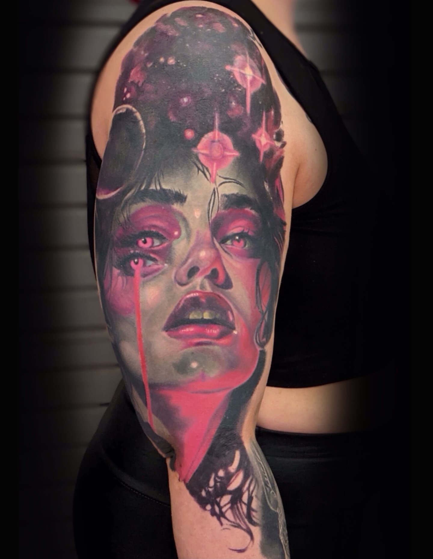 Woman's face realism tattoo on the forearm by Brandon Bowie