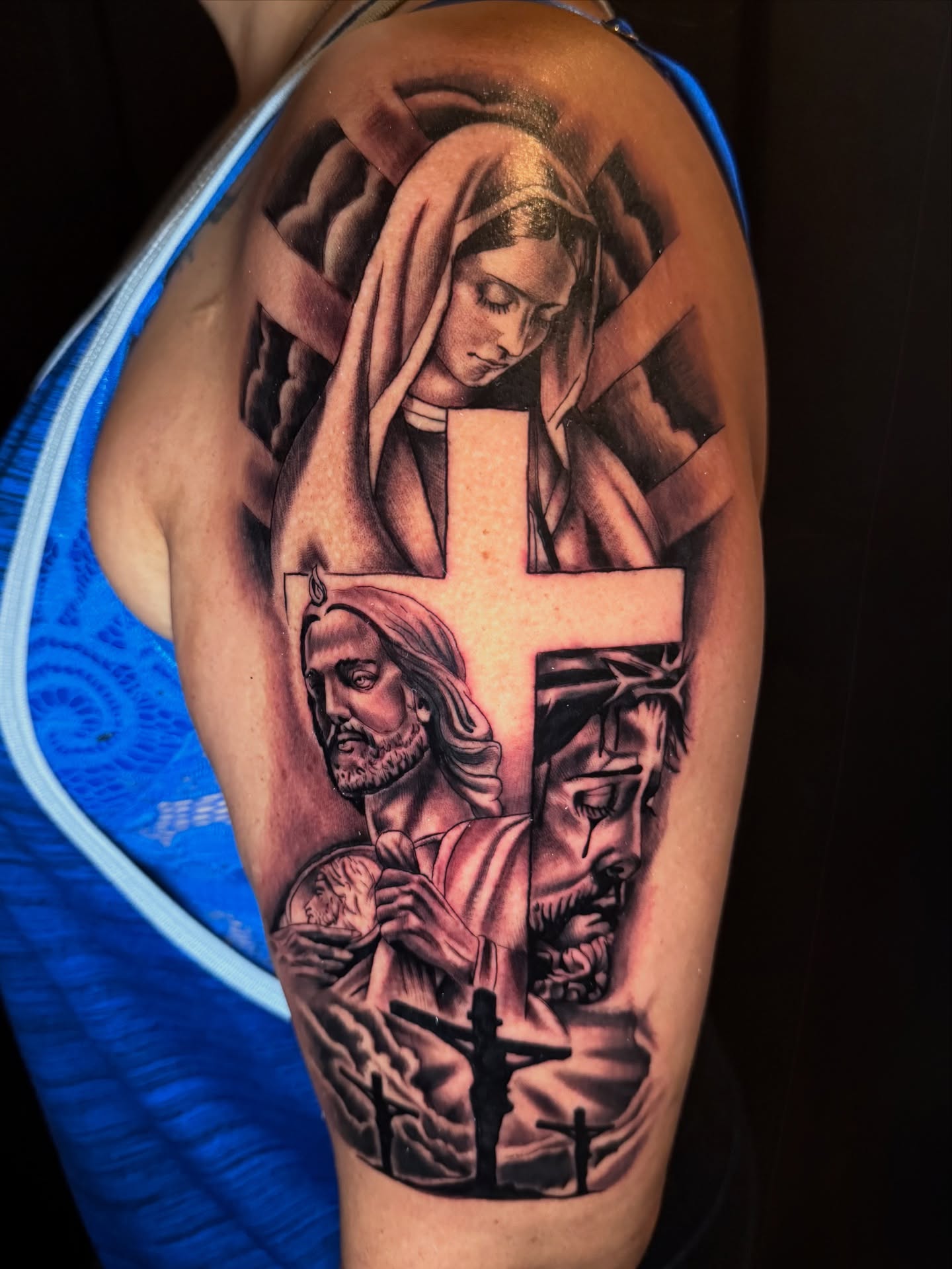 Religious scene realism tattoo on the shoulder by Eduardo Chaparro