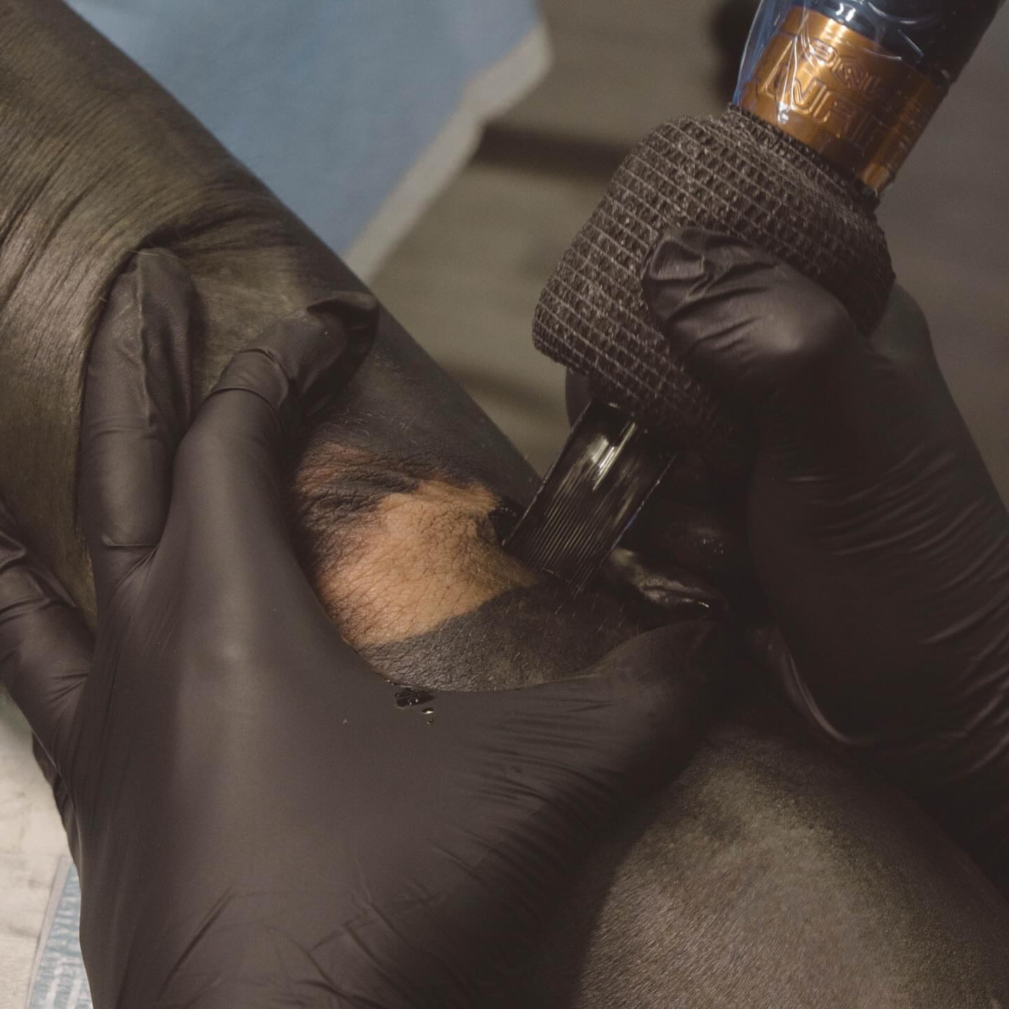 Animal black and grey tattoo on the upper arm by Romans