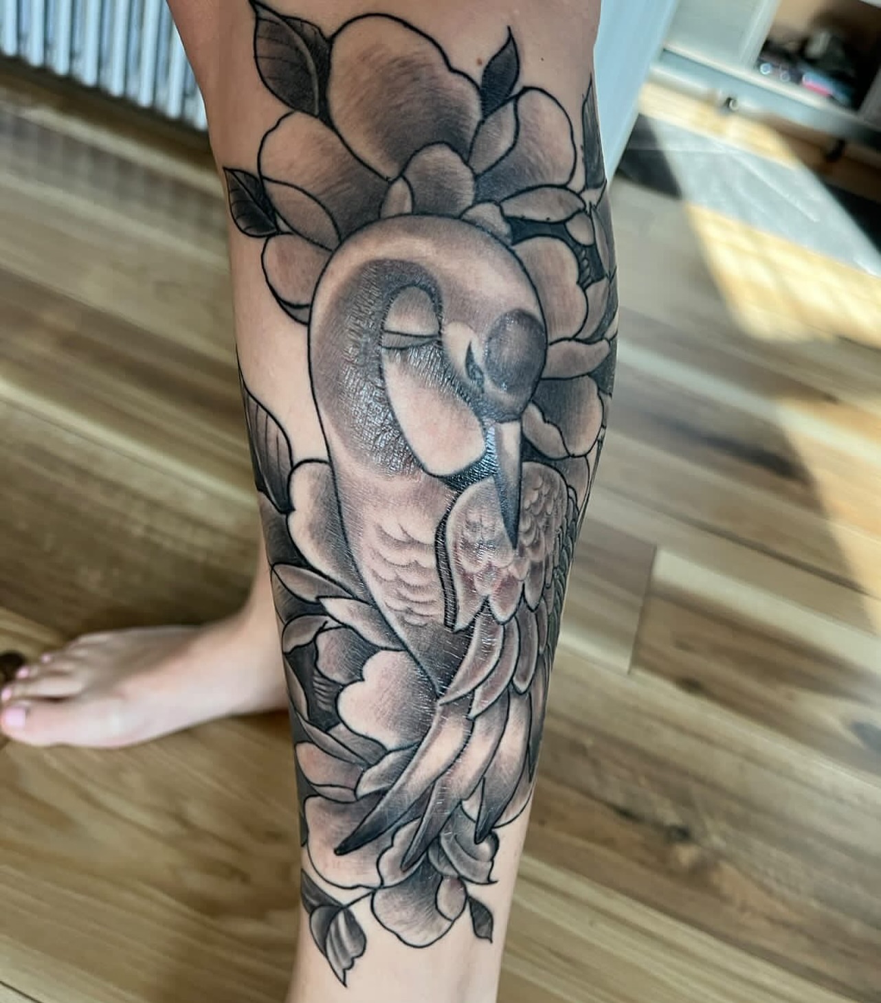 Owl and flowers black and grey tattoo on the forearm by jersey ink tattoos, Elizabeth, New Jersey