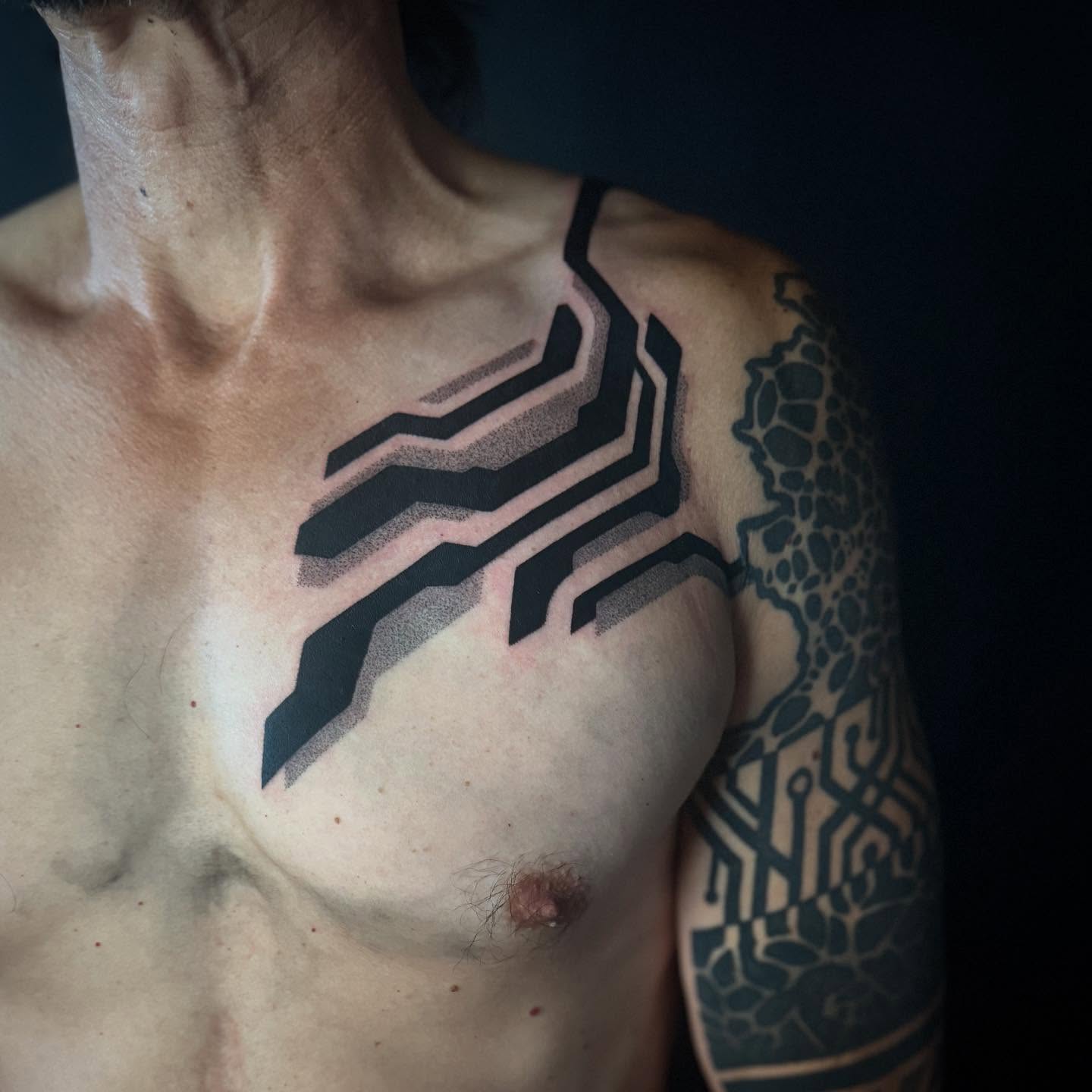 Geometric pattern dotwork tattoo on the shoulder by Dylan Orbock, Berkeley, California