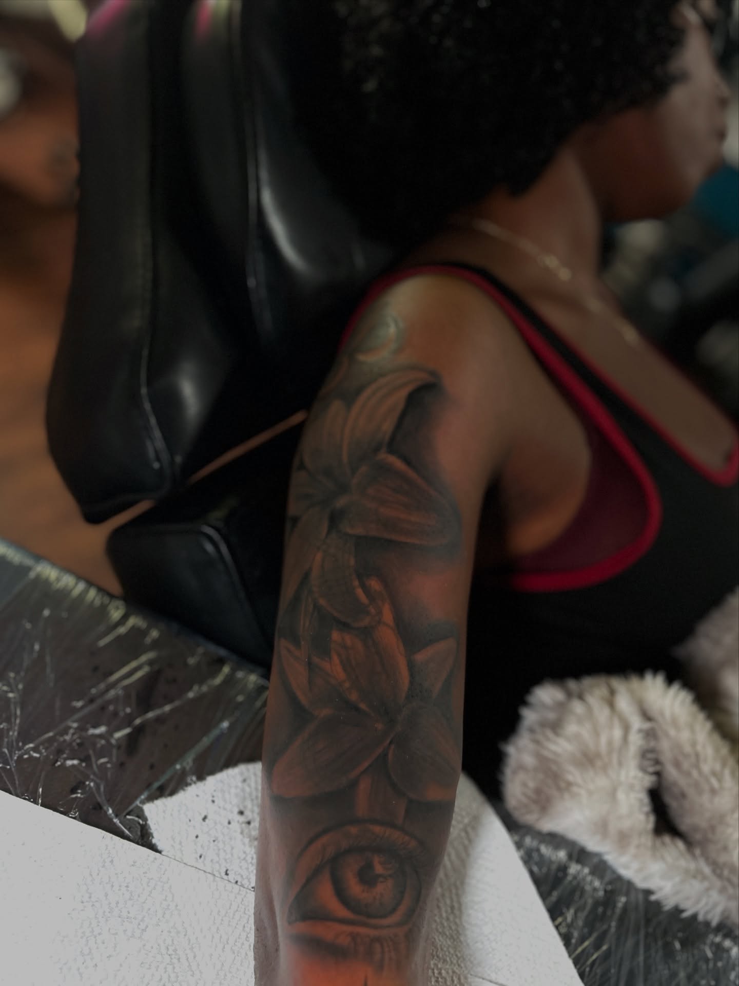 Eye and flowers realism tattoo on the forearm by ๐AK