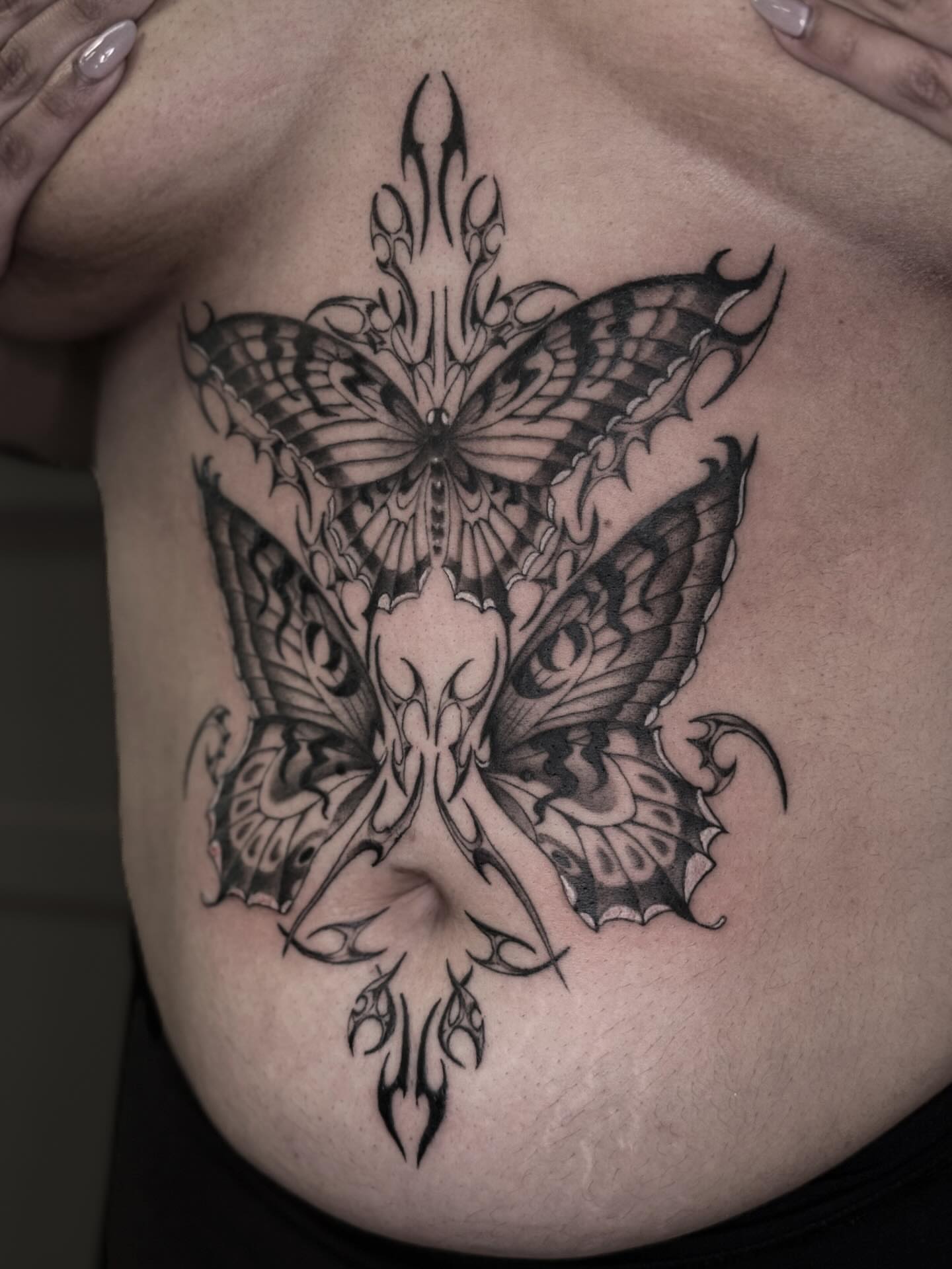 Butterfly tribal tattoo on the chest by 𝕮𝖞𝖇𝖊𝖗𝕾𝖎𝖌𝖎𝖑𝖎𝖘𝖒
