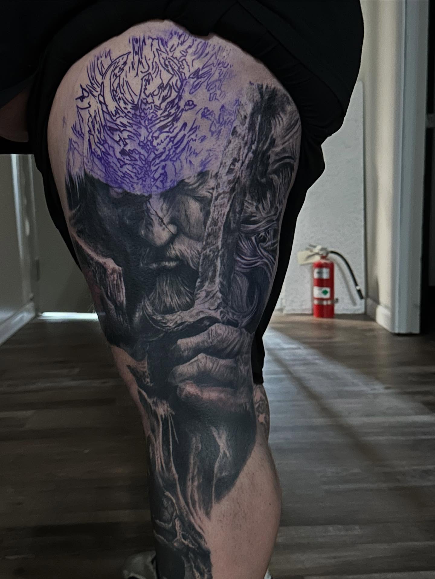 Man's face realism tattoo on the thigh by Neil5one3