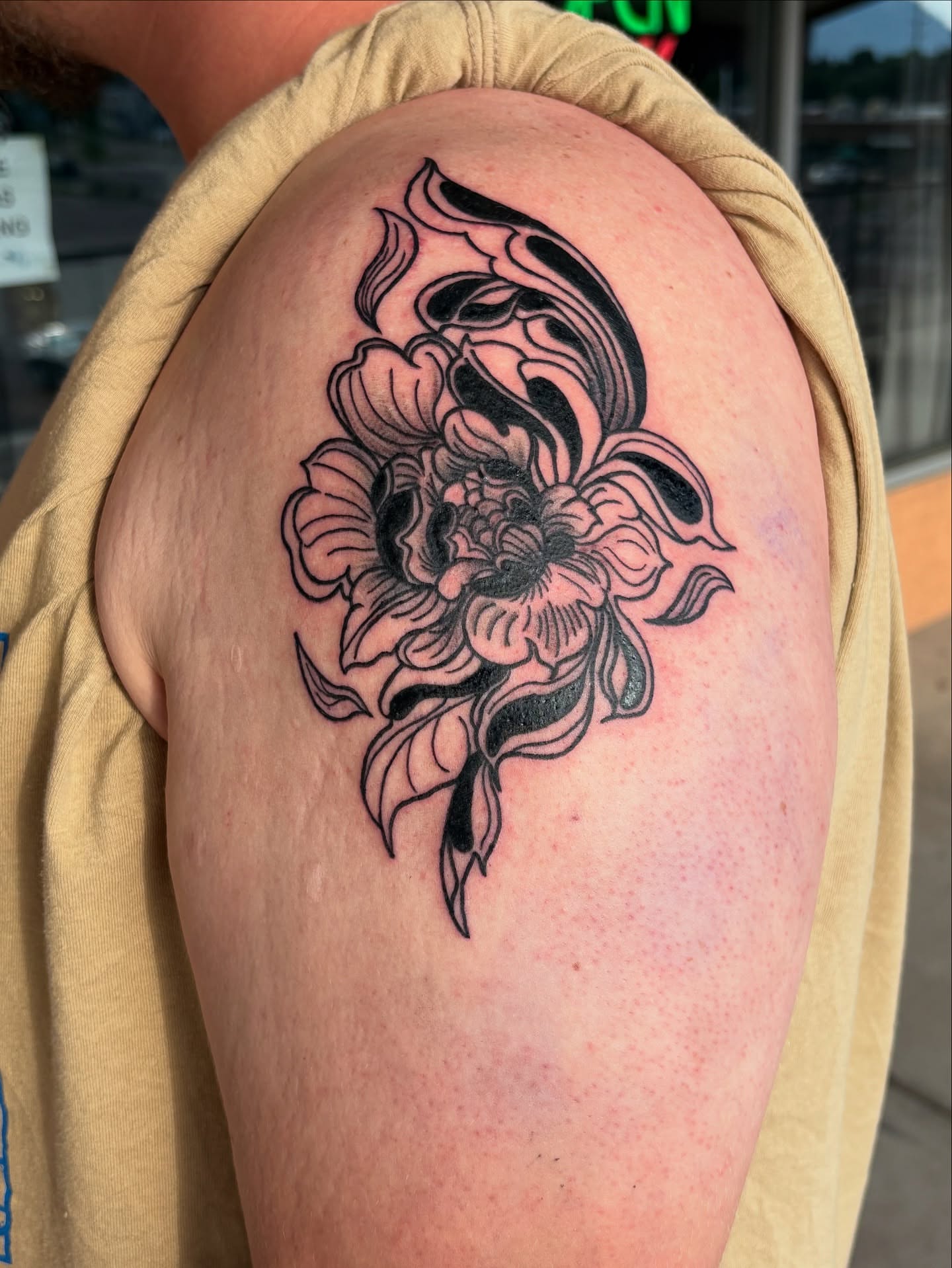 Floral design black and grey tattoo on the shoulder by Tori Anderson, Minneapolis, Minnesota