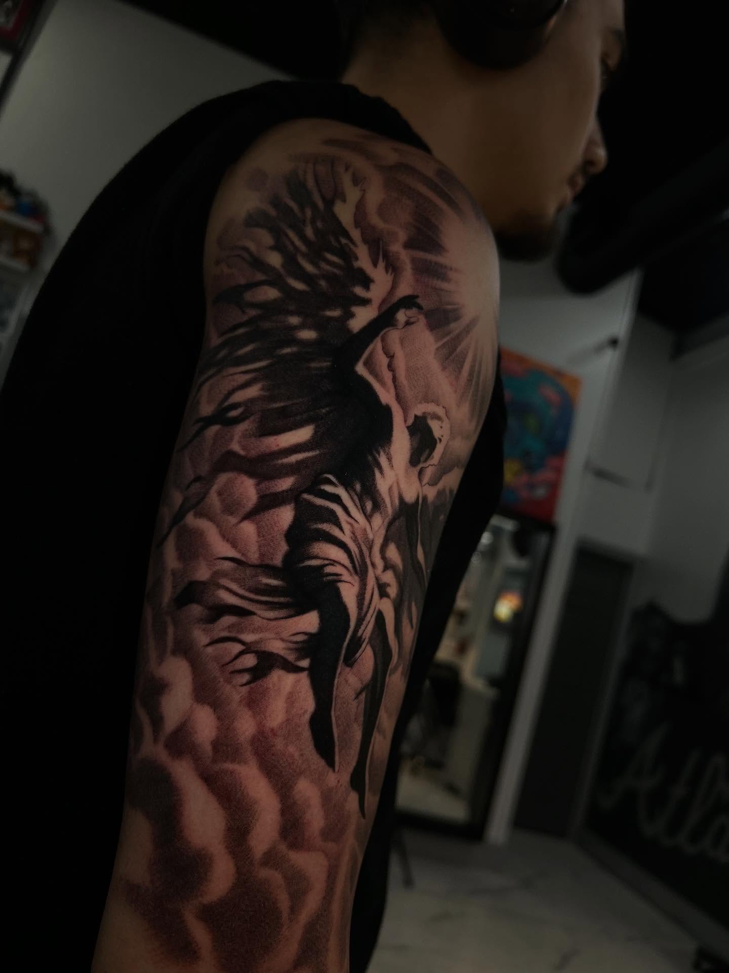 Bird realism tattoo on the upper arm by Jaylen - Atlanta Tattoo Artist