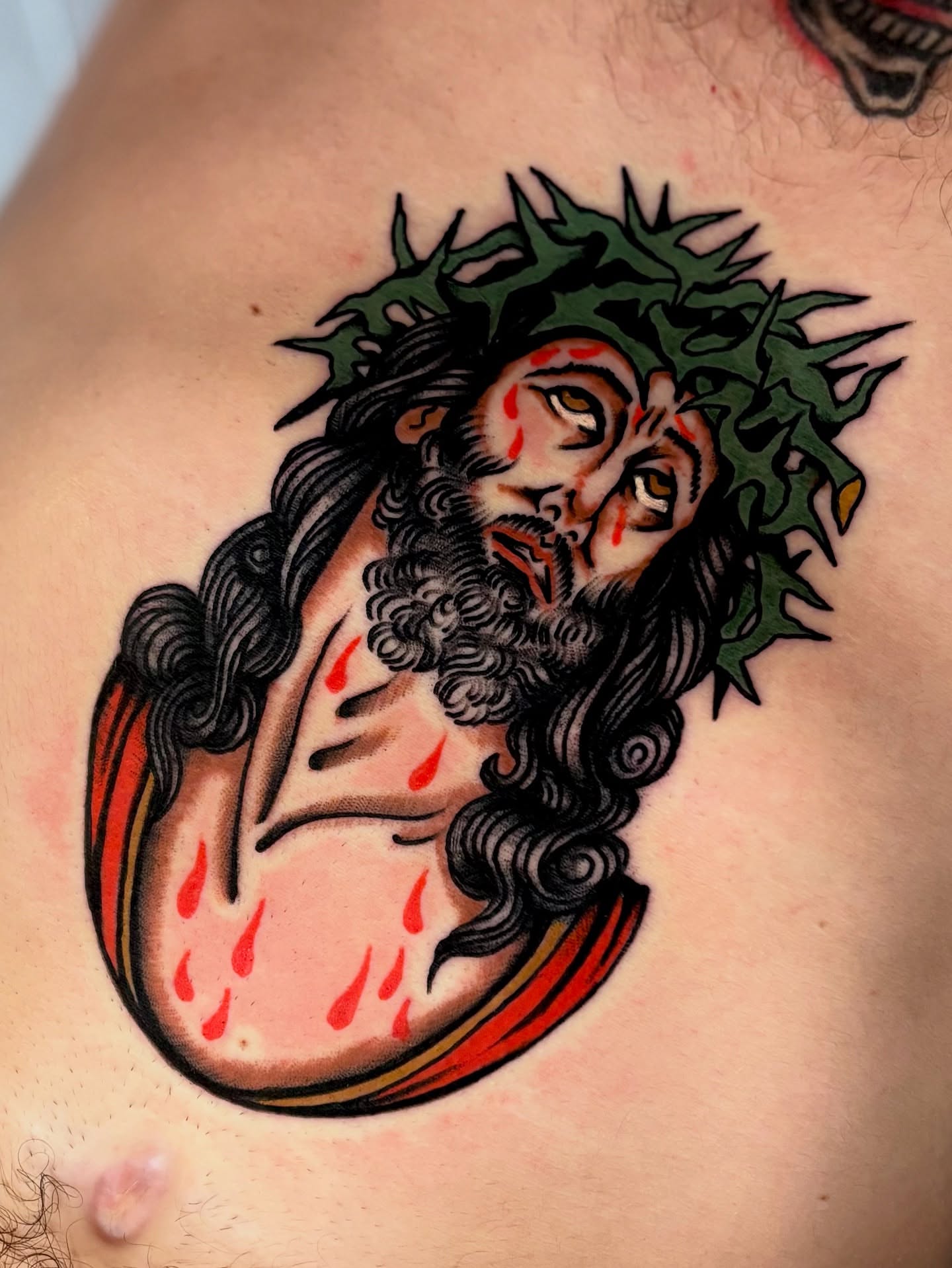 Jesus Christ American traditional tattoo on the chest by Weston Imhoff