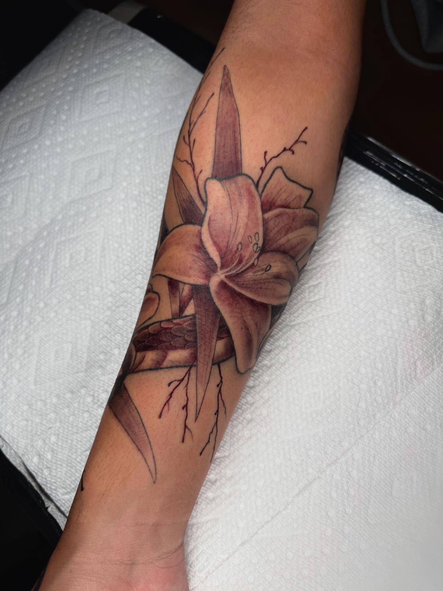Lily realism tattoo on the forearm by Denver Tattoo Artist