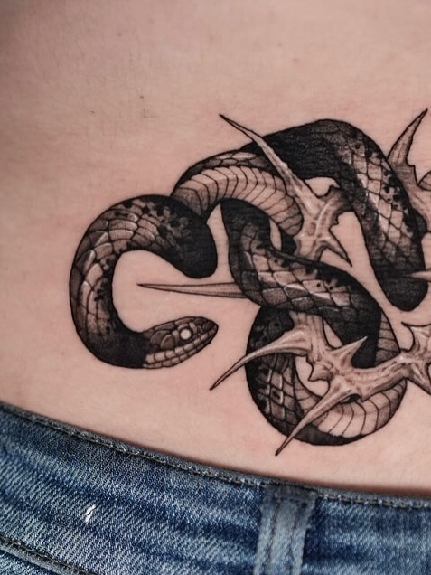 Snake black and grey tattoo on the thigh by Blackwork A P S O