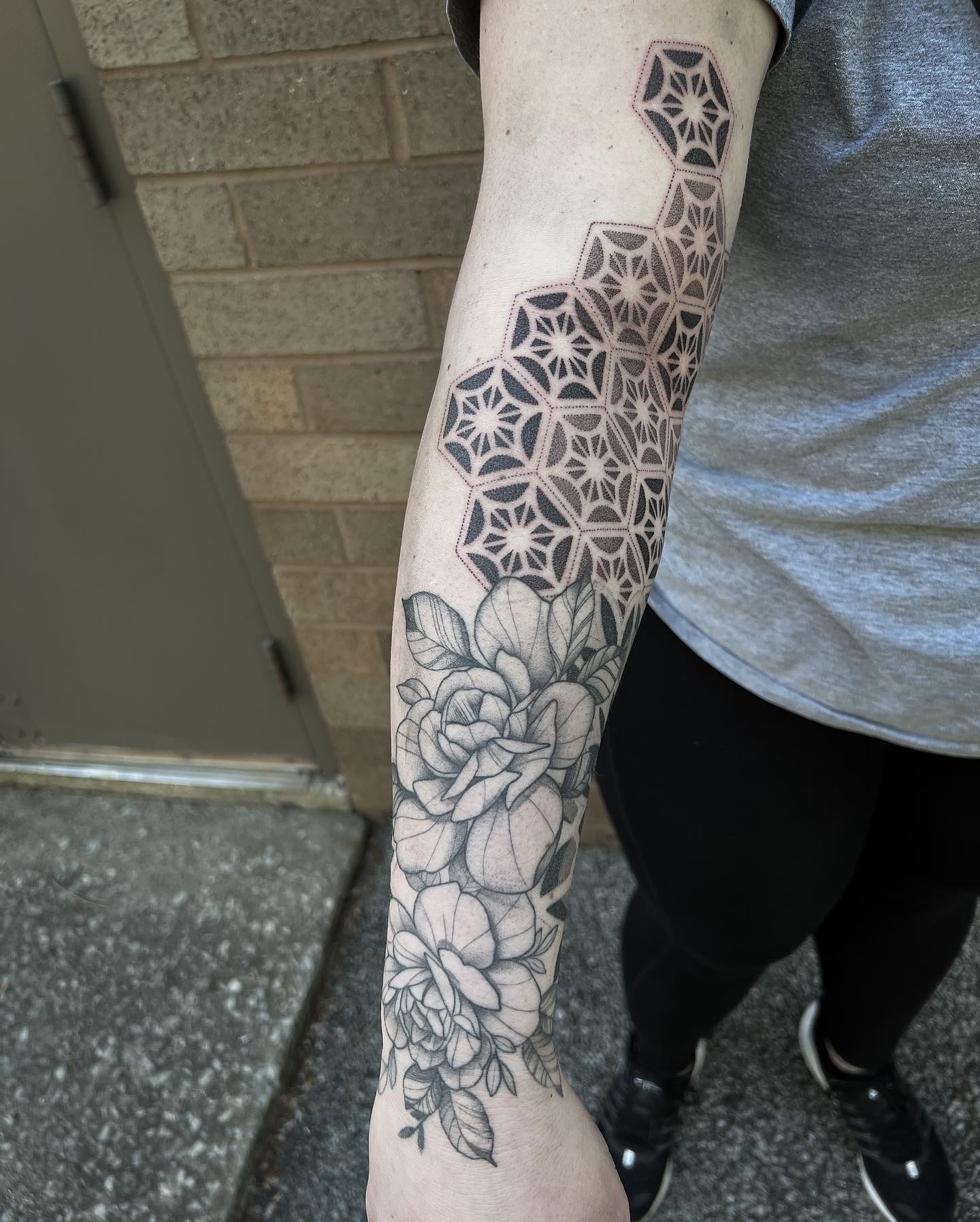 Geometric pattern with floral elements geometric tattoo on the forearm by Christofer Irvin