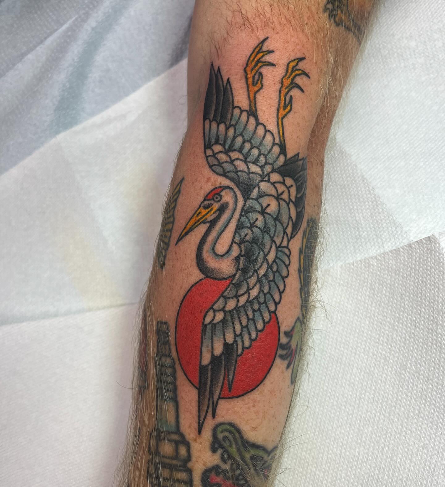 Crane American traditional tattoo on the forearm by Brian Mcfadden