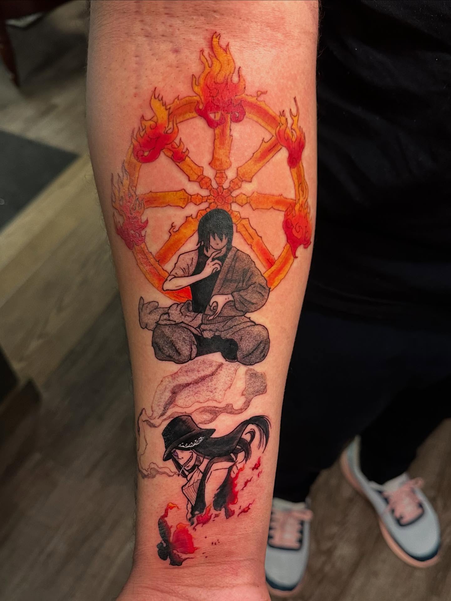 Anime character anime tattoo on the forearm by Damon Moore
