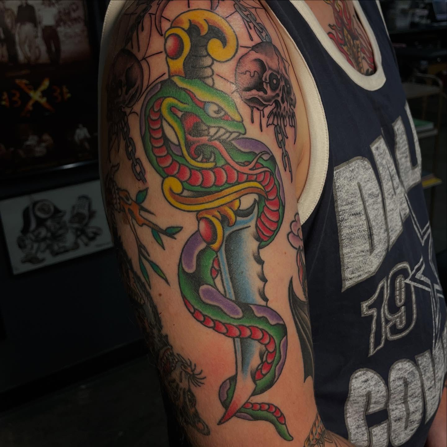 Snake and dagger American traditional tattoo on the forearm by Hannah Edwards, Austin, Texas