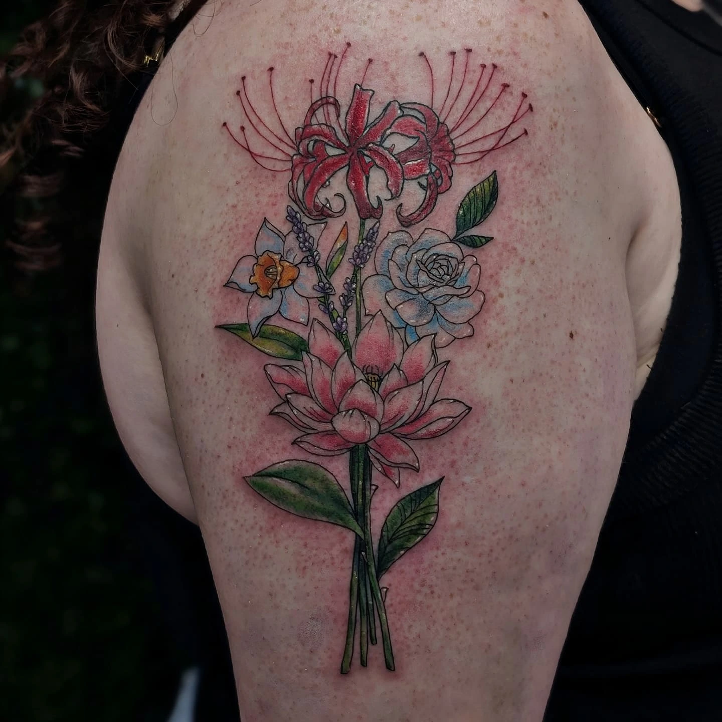 Flower bouquet realism tattoo on the shoulder by Marlayna Connelly