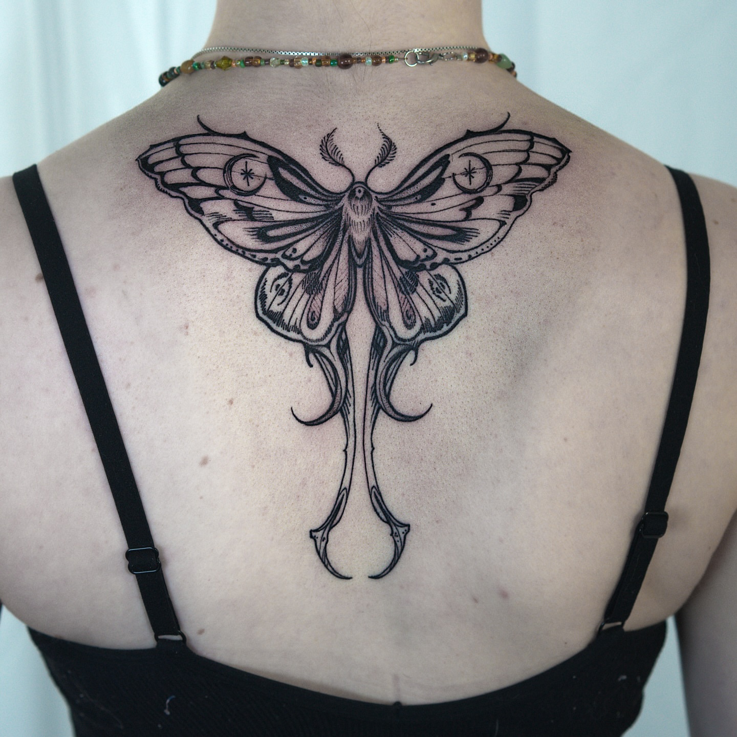 Moth black and grey tattoo on the back by H I R A  L U P E - tattoo artist, Oakland, California
