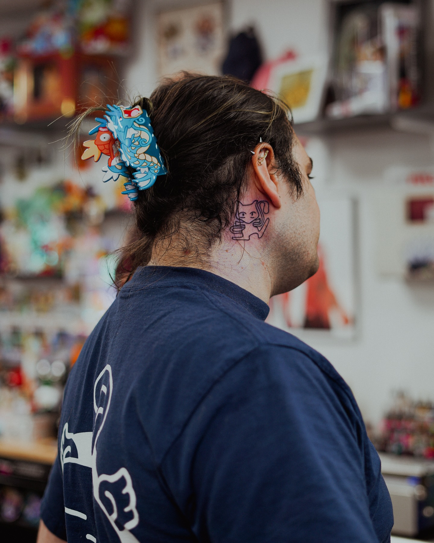 Two figures dotwork tattoo on the neck by Damon Moore