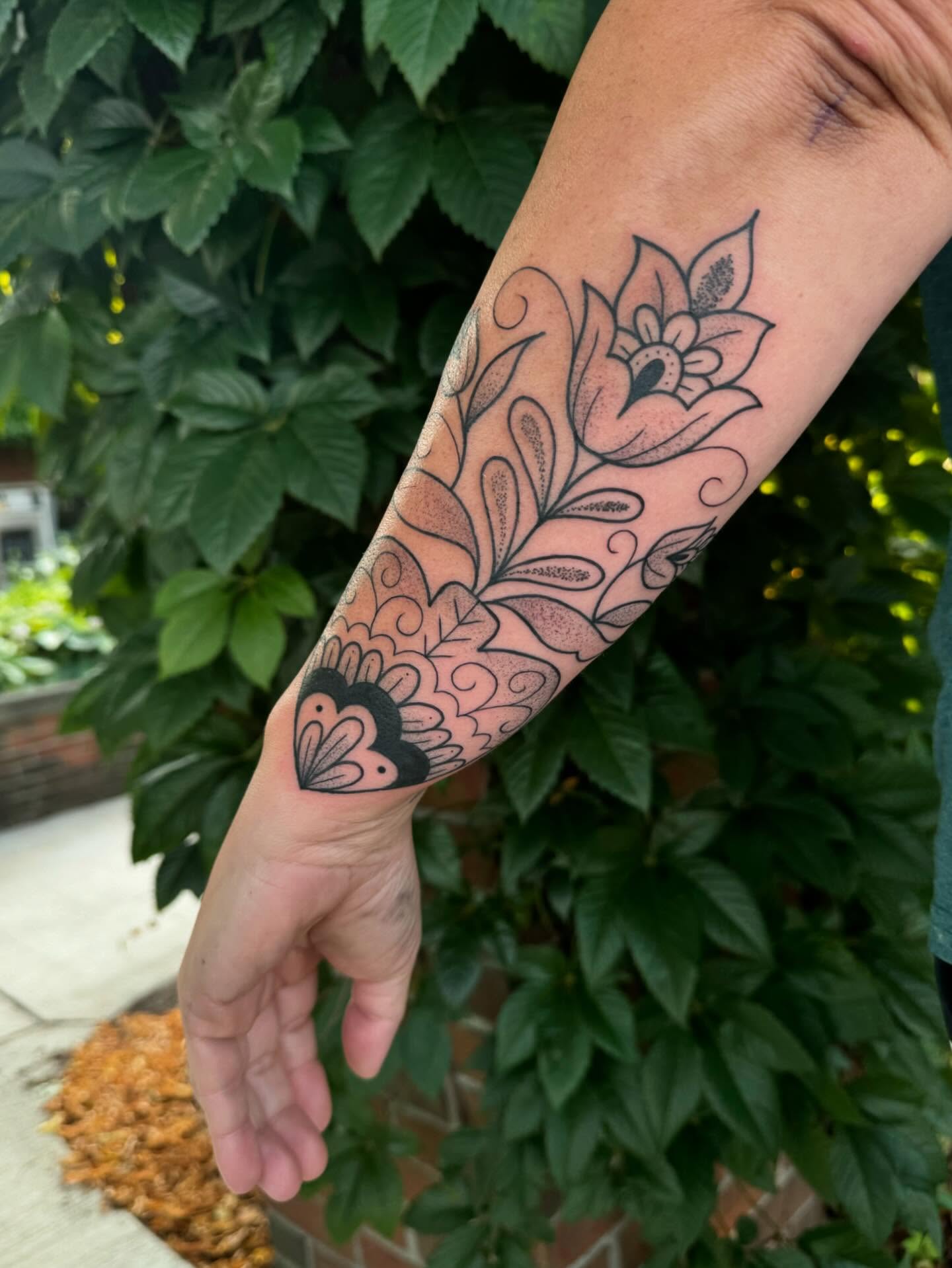 Floral design black and grey tattoo on the forearm by ꧁꧁Hayley꧂꧂