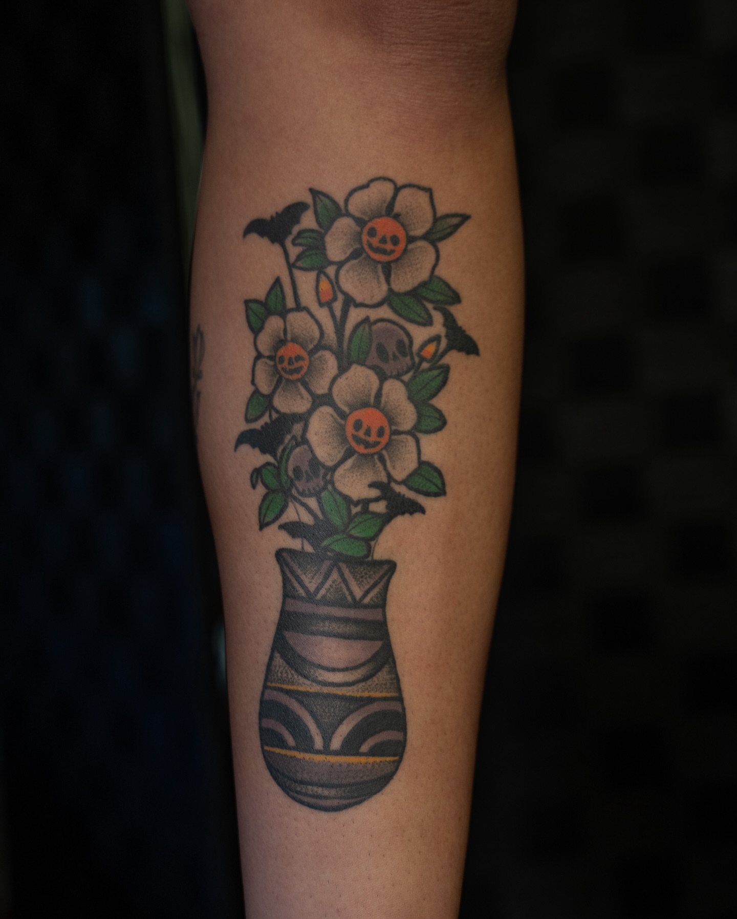 Flower bouquet neo-traditional tattoo on the forearm by Chris Estrada