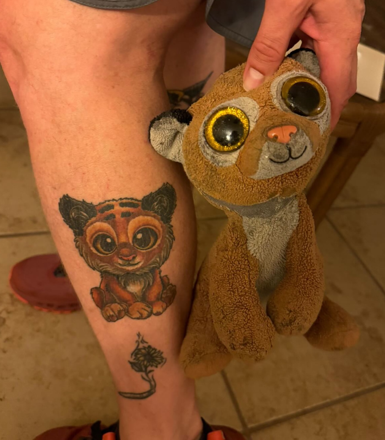 Tiger cub realism tattoo on the thigh by Alexandra Fische