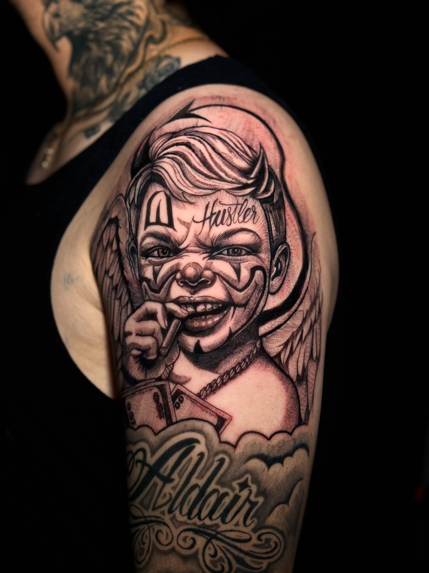 Clown with wings American traditional tattoo on the forearm by German Patiño.