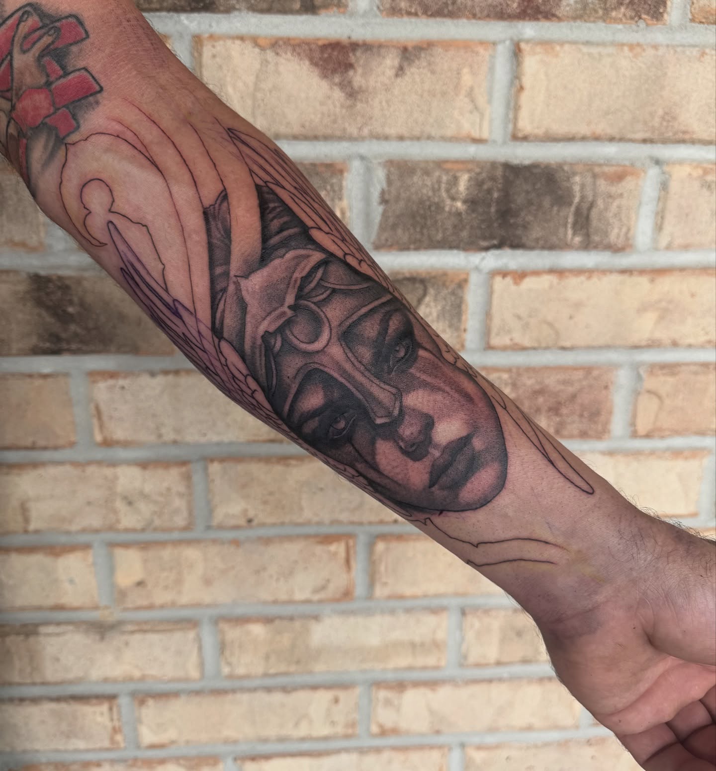 Warrior helmet black and grey tattoo on the forearm by Storm