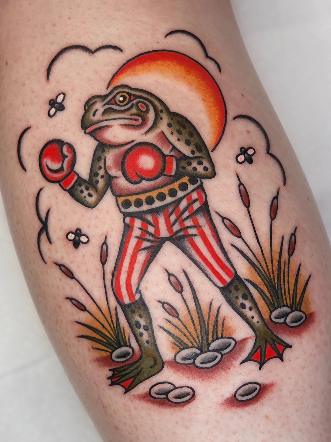 Boxing frog American traditional tattoo on the thigh by 𝘈𝘋𝘈𝘔 𝘉𝘈𝘙𝘕𝘌𝘚