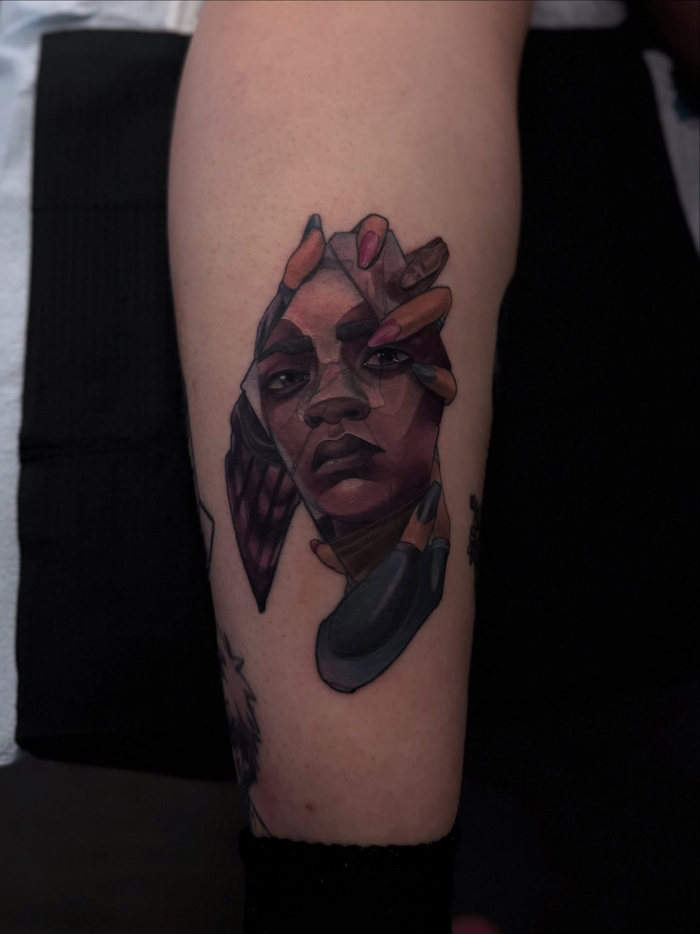 Abstract portrait geometric tattoo on the forearm by Alyssa Shirkey