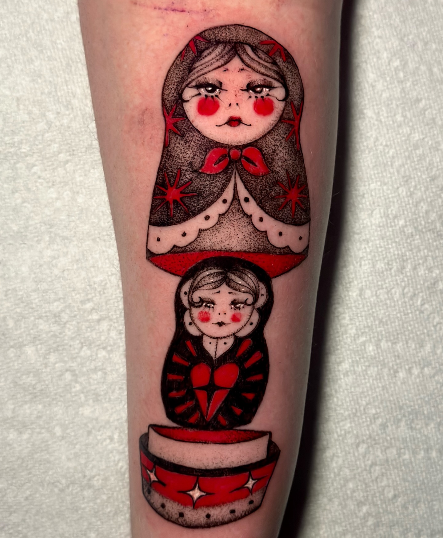 Matryoshka dolls American traditional tattoo on the forearm by cora cupid