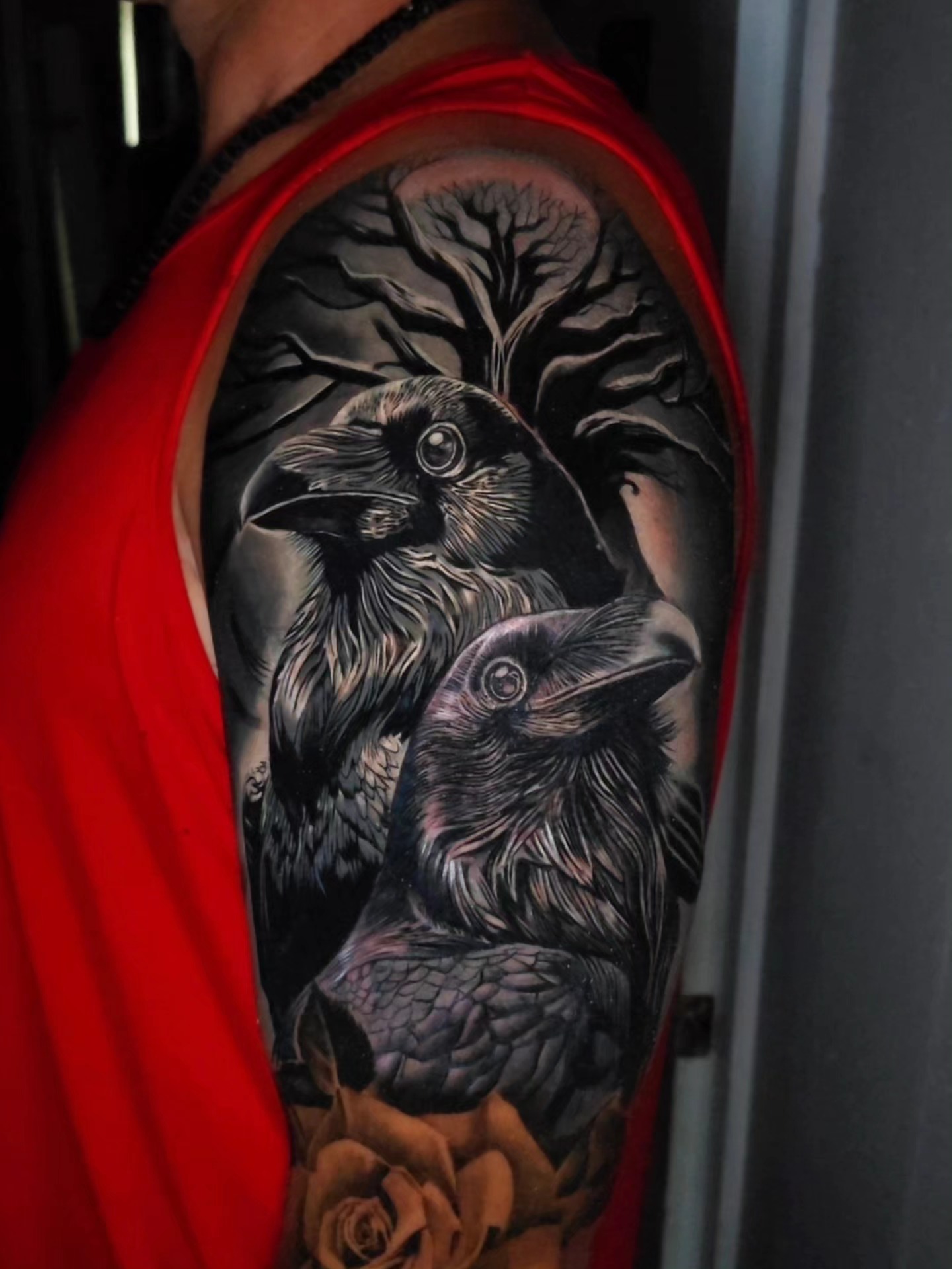 Ravens and roses realism tattoo on the upper arm by Javier M Davila