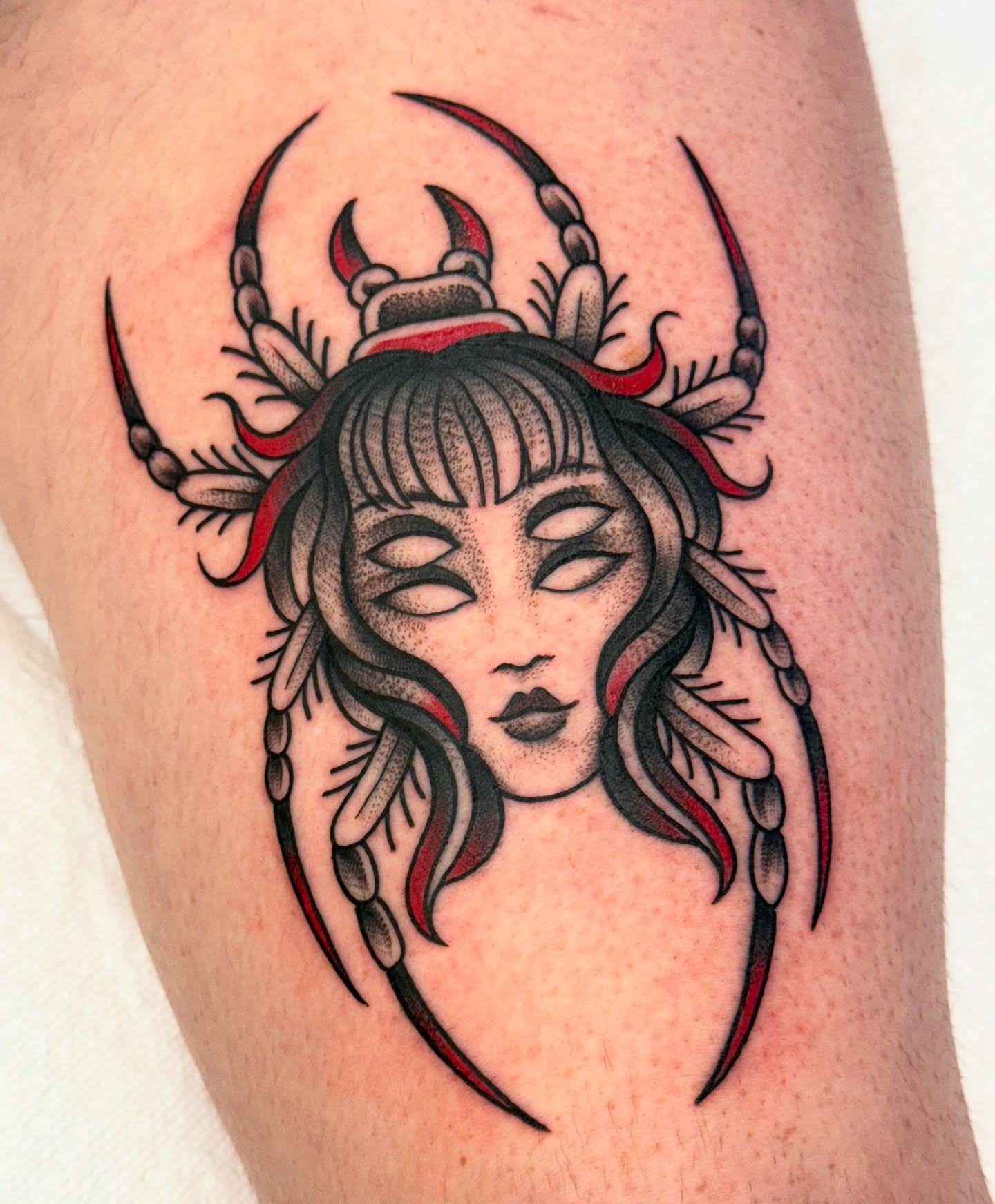 Woman with horns American traditional tattoo on the thigh by jenna clark🎨