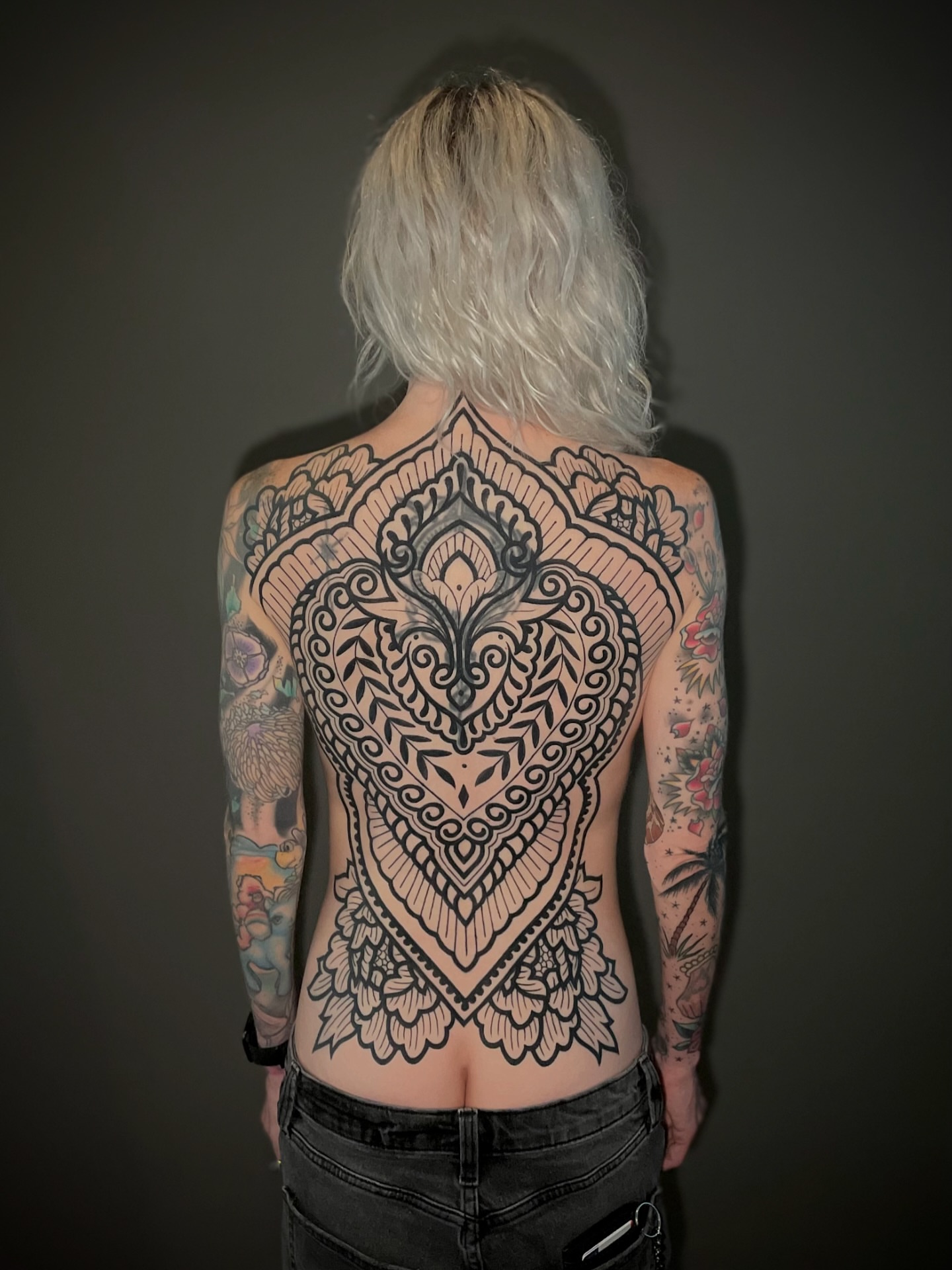 Mandala ornamental tattoo on the back by Ｊｉｍ Ｓｙｌｖｉａ