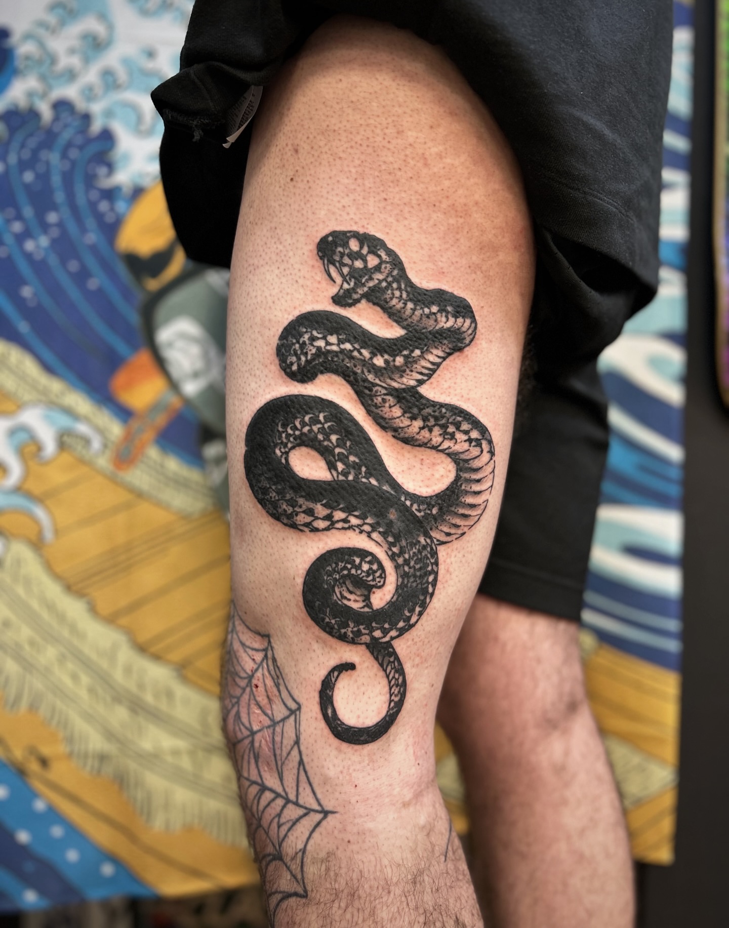 Snake black and grey tattoo on the thigh by Comastein__________✍🏼️